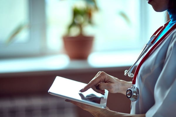 doctor looking at patient scheduling with radiology information systems